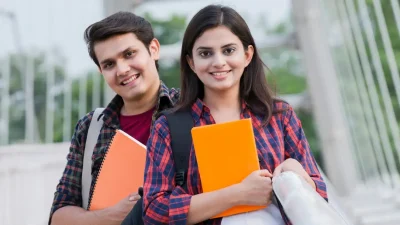 A college boy and girl smiling after the classes